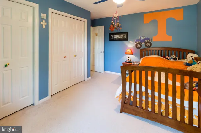 a bedroom with bed and a window