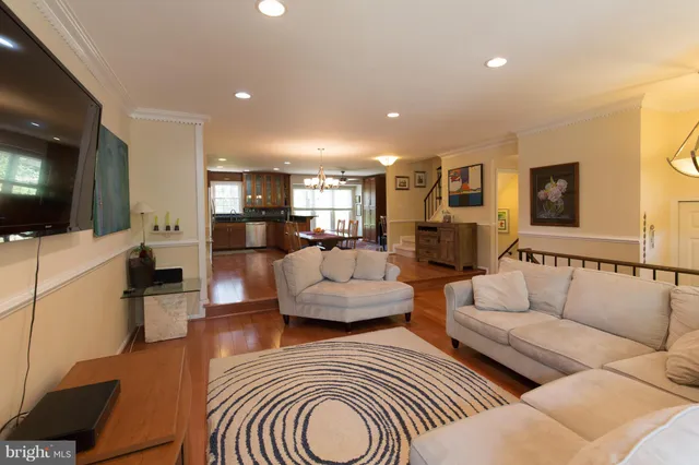 a living room with fireplace furniture and a flat screen tv