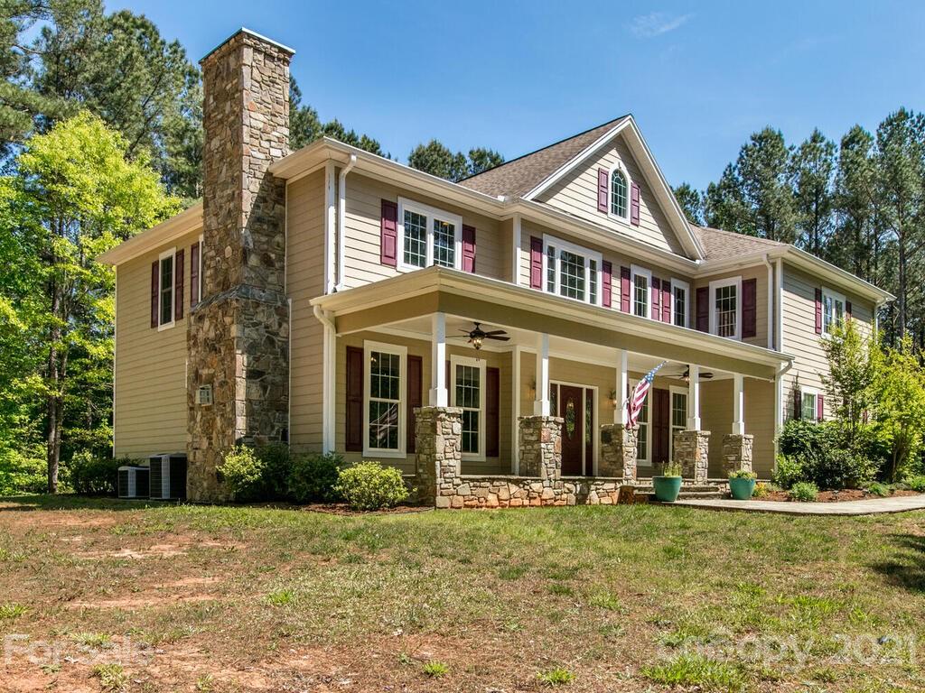 356 Green Hills Road Mill Spring, NC 28756 - Photo 1 of 31 front view of a house with a yard
