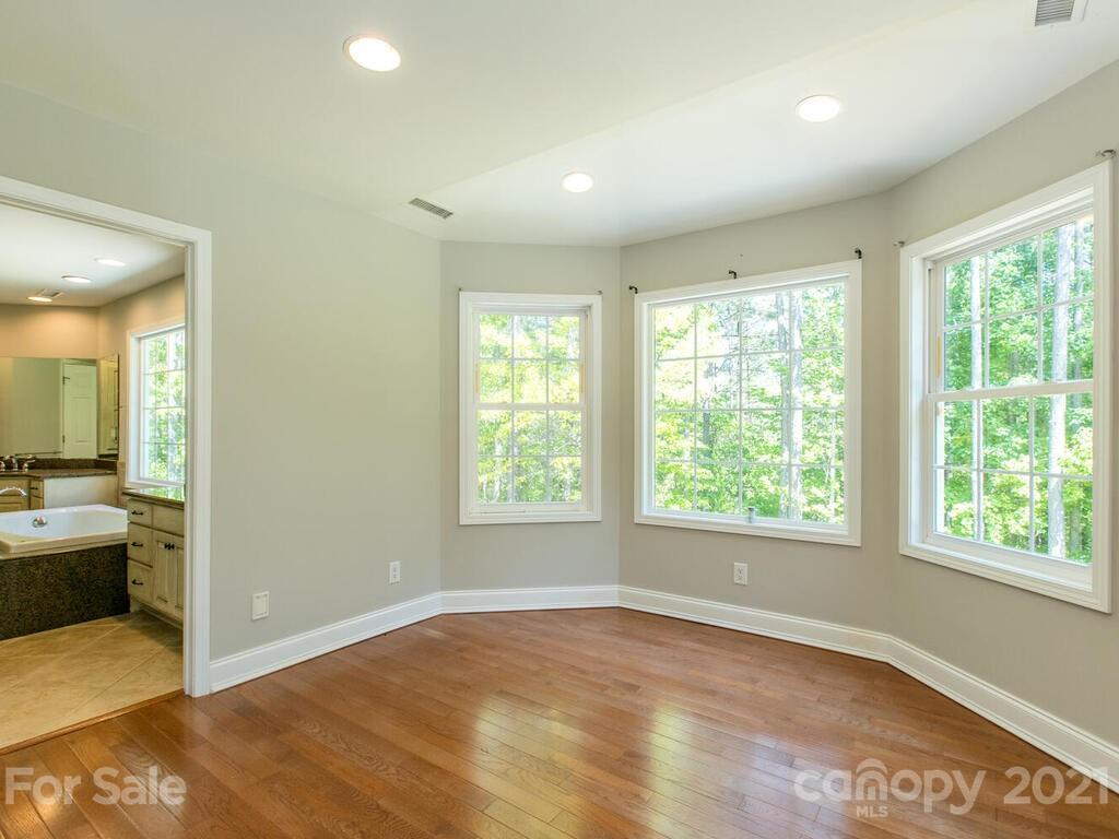 356 Green Hills Road Mill Spring, NC 28756 - Photo 17 of 31 a view of an empty room with a window