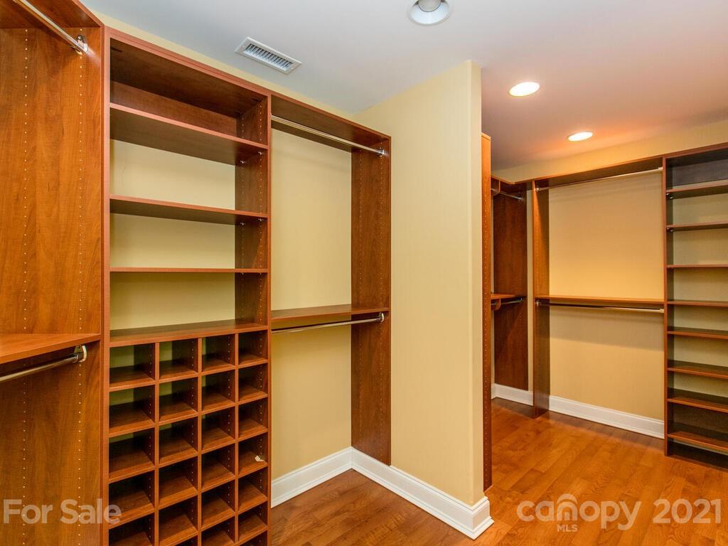 356 Green Hills Road Mill Spring, NC 28756 - Photo 19 of 31 a view of walk in closet with empty racks