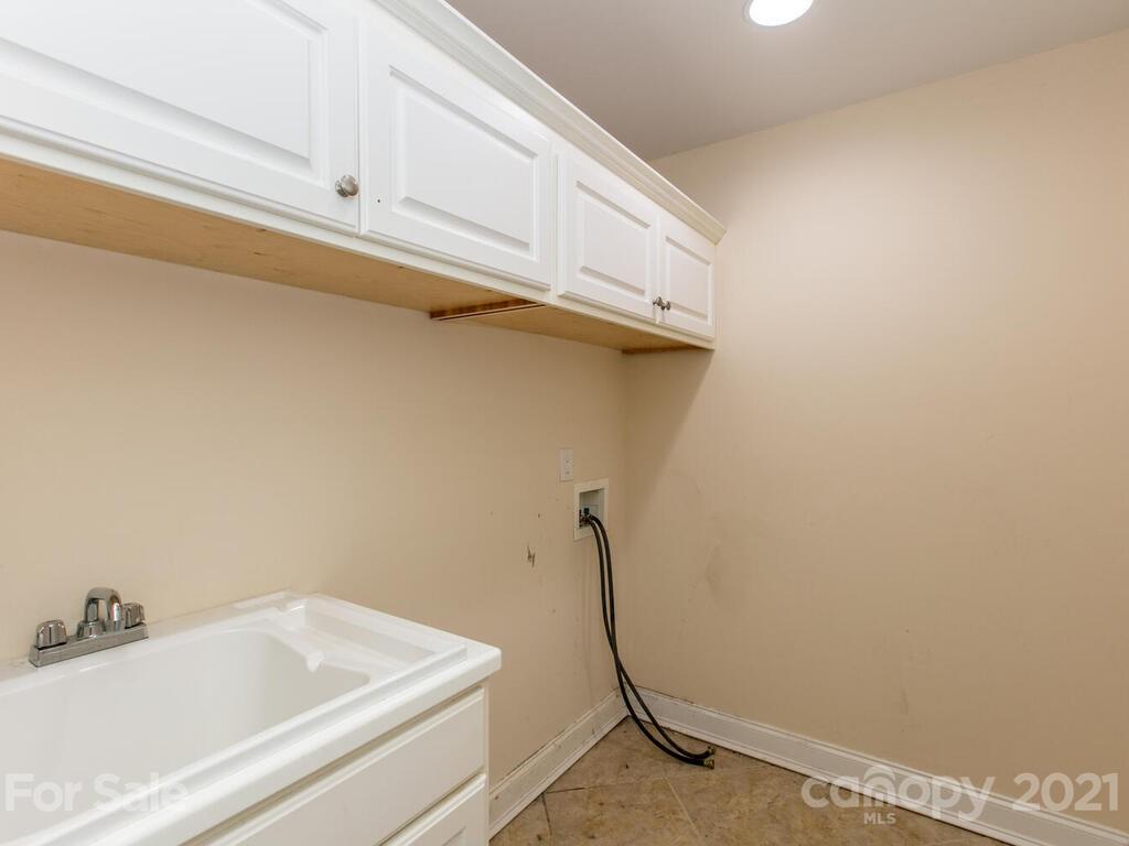356 Green Hills Road Mill Spring, NC 28756 - Photo 25 of 31 a bathroom with a sink and a bathtub
