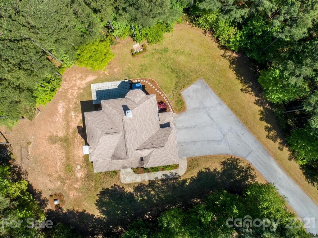 356 Green Hills Road Mill Spring, NC 28756 - Photo 28 of 31 an aerial view of a house with yard and swimming pool
