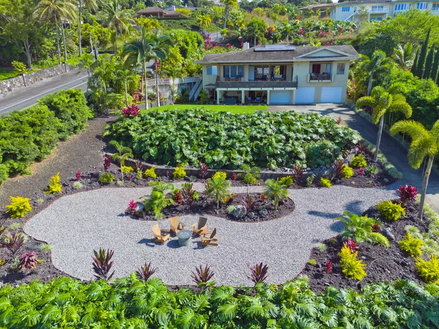 front view of a house with a lot of flower and a flower