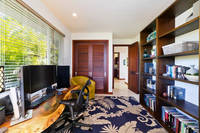 a living room with lots of furniture and a flat screen tv
