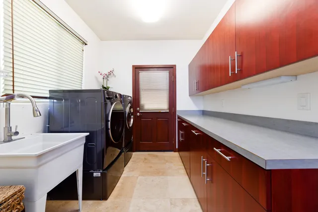 a kitchen with a sink a refrigerator and window