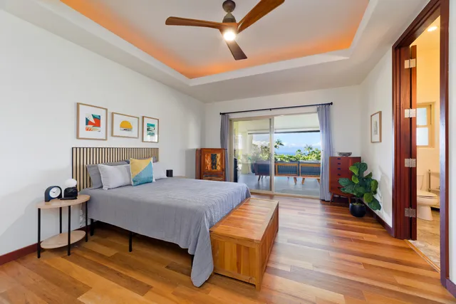 a bedroom with a bed and a view of bedroom