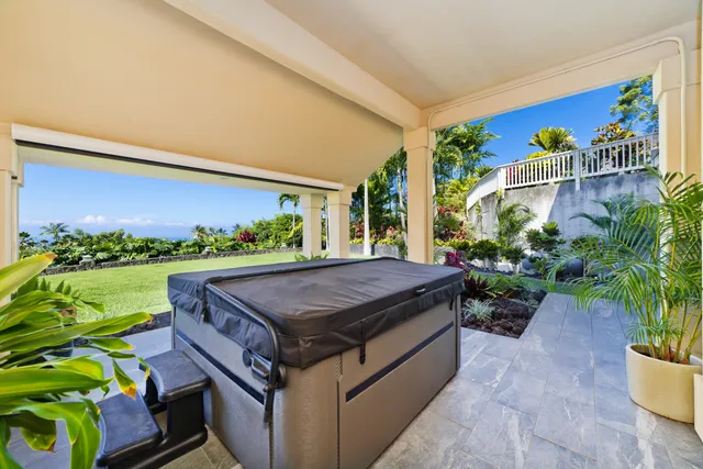 a view of a chairs and table in a backyard