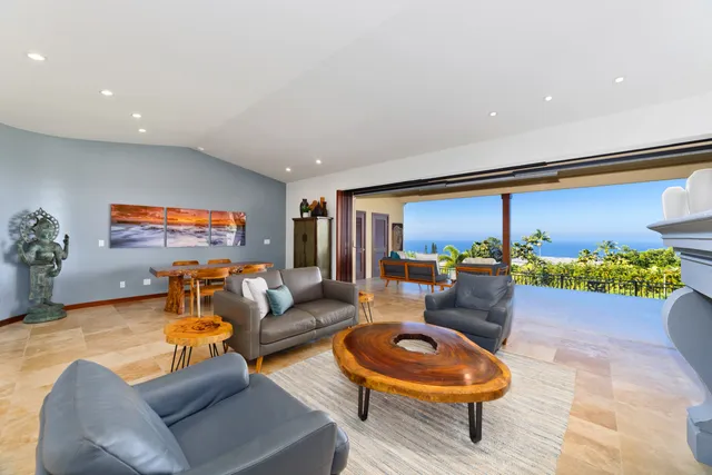 a living room with furniture and a rug