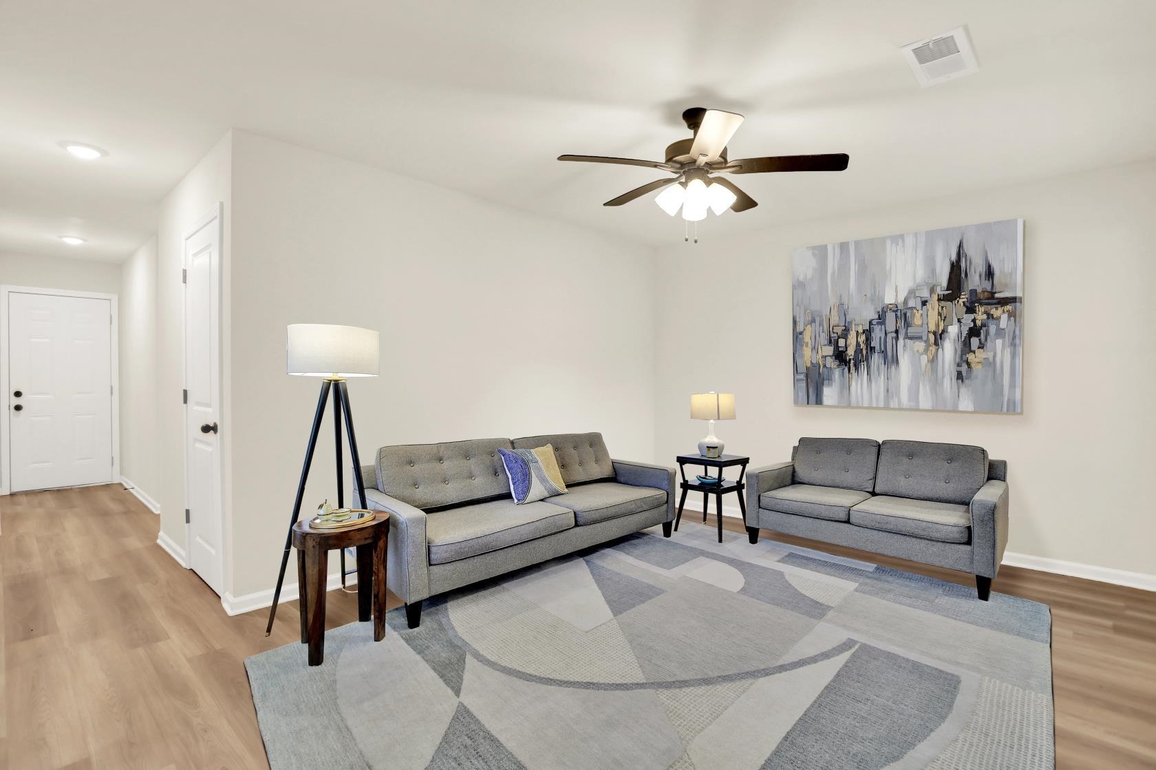 2531 Smith Ridge Road Memphis, TN 38127 - Photo 11 of 14 a living room with furniture and a wooden floor
