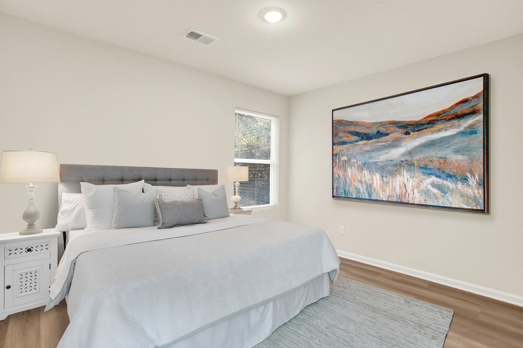 2531 Smith Ridge Road Memphis, TN 38127 - Photo 13 of 14 a bed room with a bed and a painting on the wall