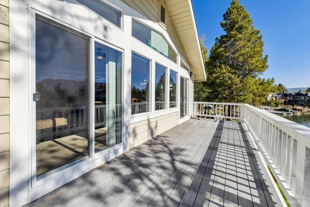 a view of balcony with wooden floor and seating space