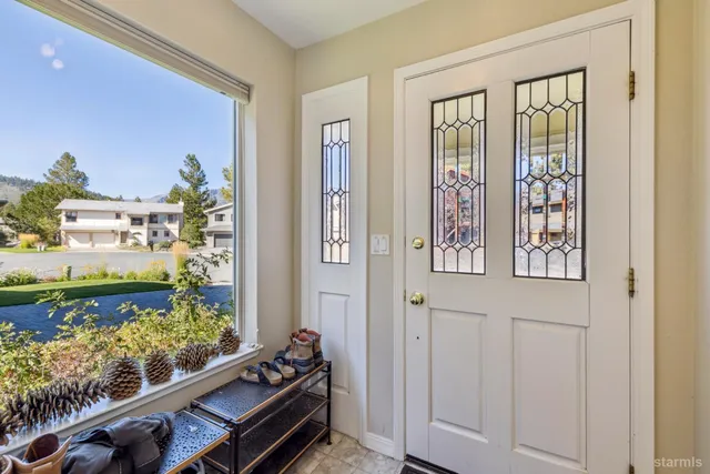 a view of a balcony with wooden floor
