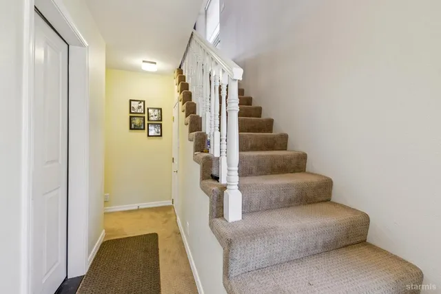 a view of entryway and hall with a couch