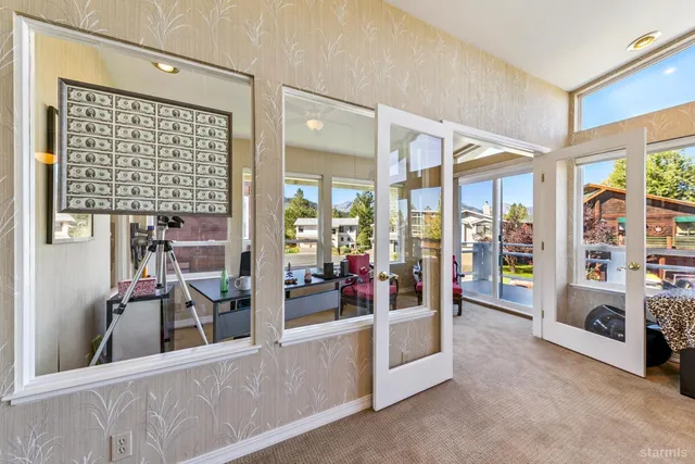 a view of a living room and entry way