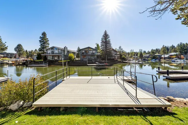 a view of a lake with houses in the background