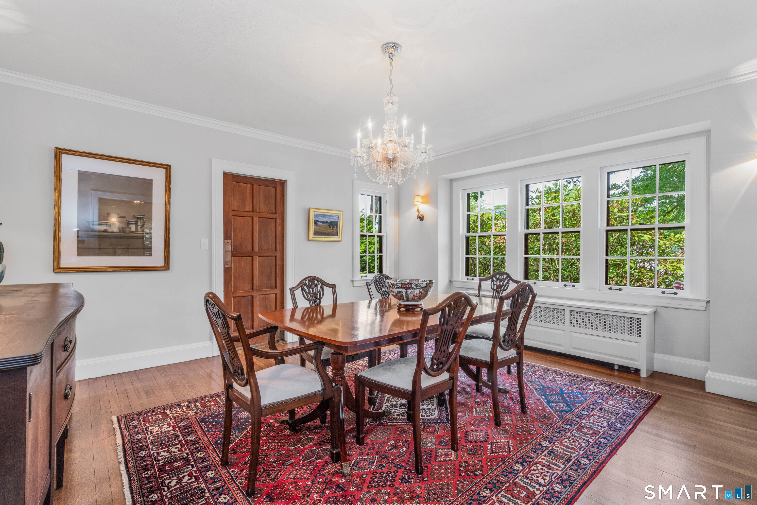 7 Fernwood Road West Hartford, CT 06119 - Photo 12 of 40 a view of a dining room with furniture window and wooden floor