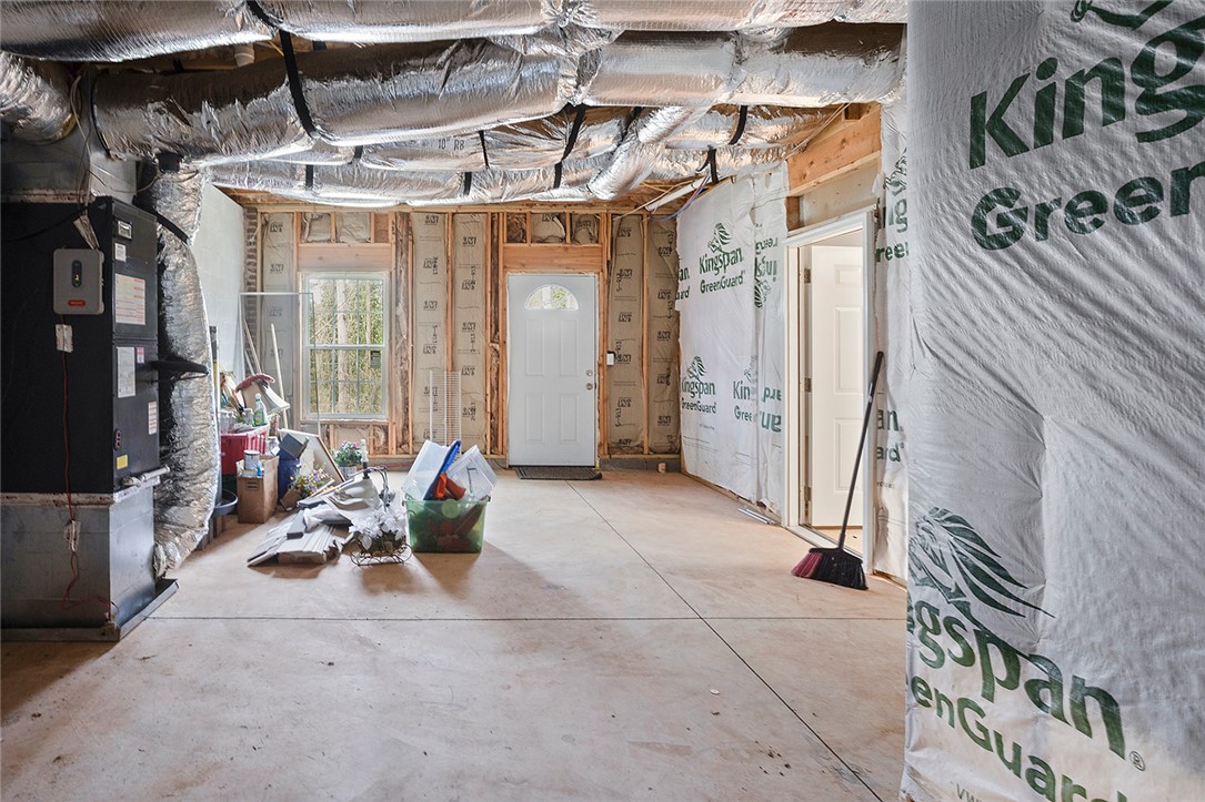 119 Nicholas Court Easley, SC 29640 - Photo 22 of 33 This spacious unfinished basement offers endless possibilities for customization and expansion.