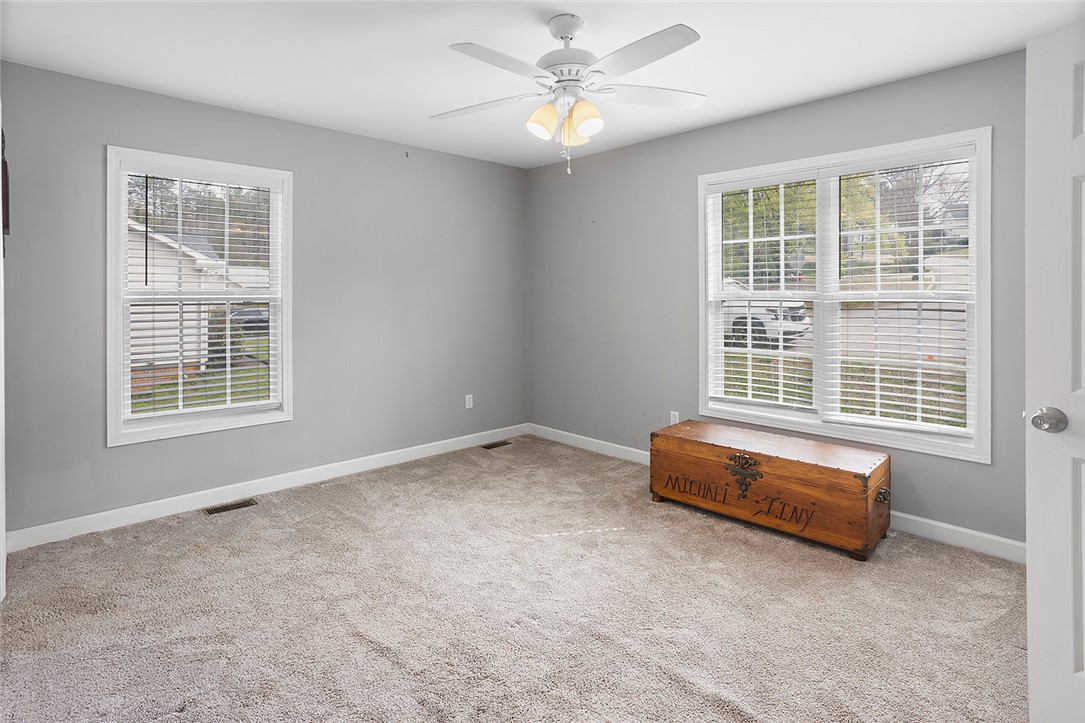 119 Nicholas Court Easley, SC 29640 - Photo 26 of 33 This spacious bedroom offers ample natural light and a comfortable atmosphere for rest and relaxation.