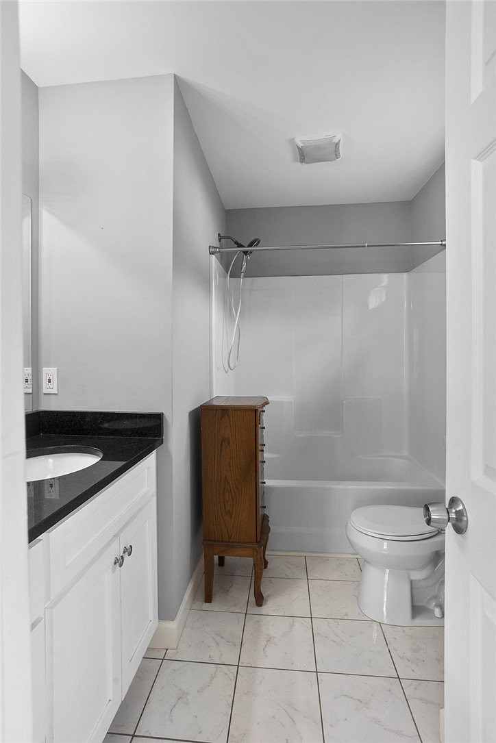 119 Nicholas Court Easley, SC 29640 - Photo 28 of 33 This bathroom features a sleek vanity, shower and toilet, offering both style and essential comfort.