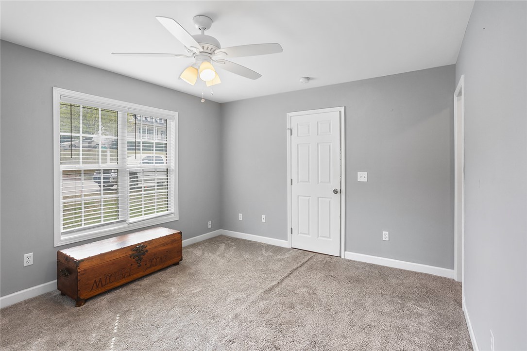 119 Nicholas Court Easley, SC 29640 - Photo 29 of 33 This spacious bedroom offers ample natural light and a comfortable ambiance.