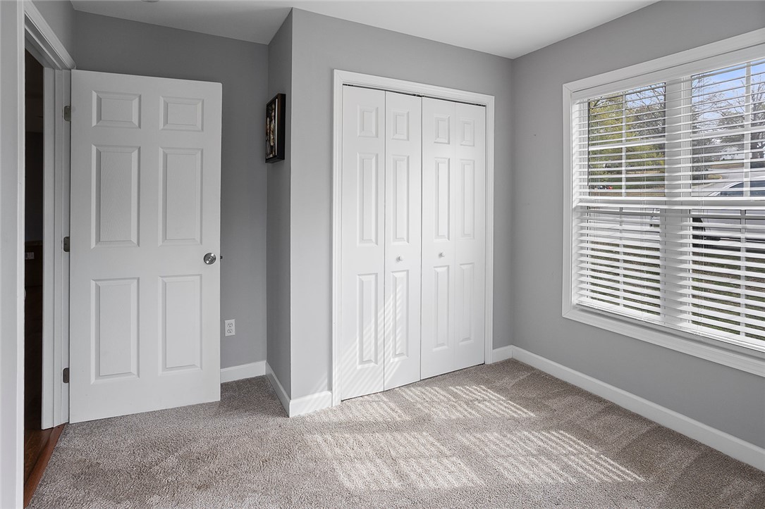 119 Nicholas Court Easley, SC 29640 - Photo 6 of 33 Bright bedroom with neutral carpet and ample natural light through a large window.
