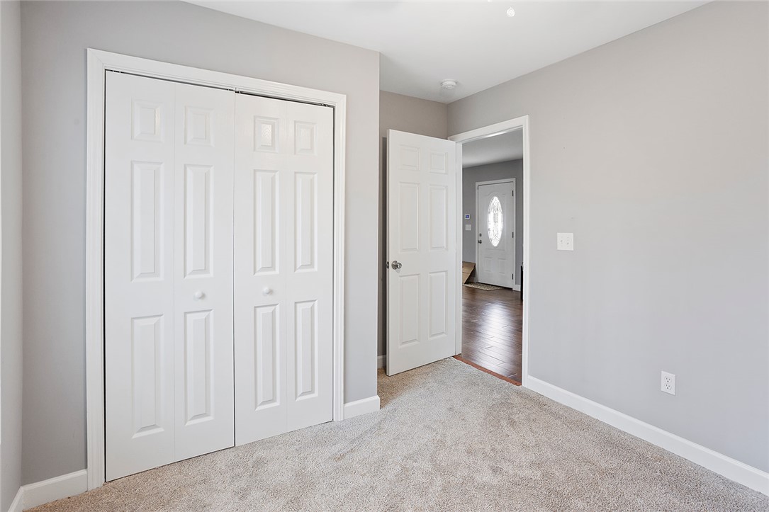 119 Nicholas Court Easley, SC 29640 - Photo 8 of 33 Bright and inviting bedroom with ample storage space and soft carpet flooring.