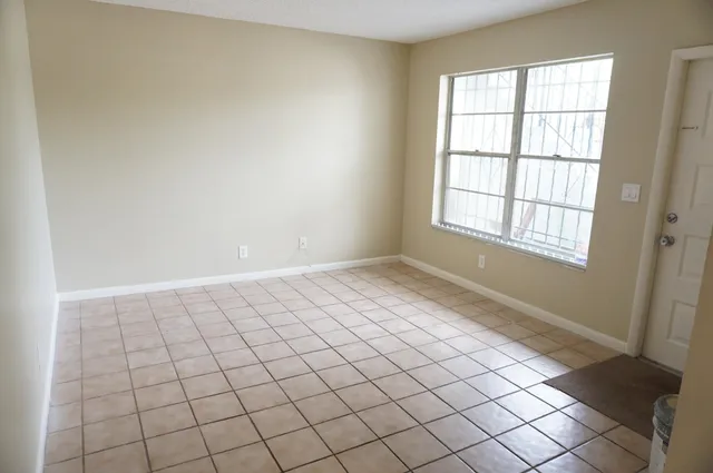 a view of an empty room and window