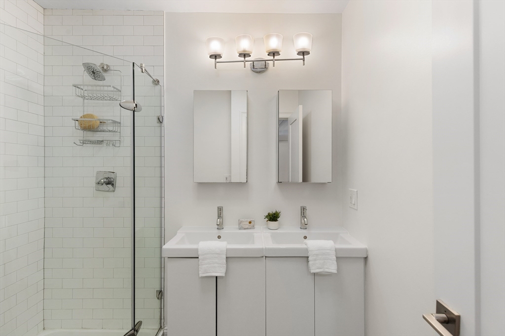 81 Prince Street, Unit 2 Boston, MA 02113 - Photo 14 of 22 a bathroom with a sink and mirror
