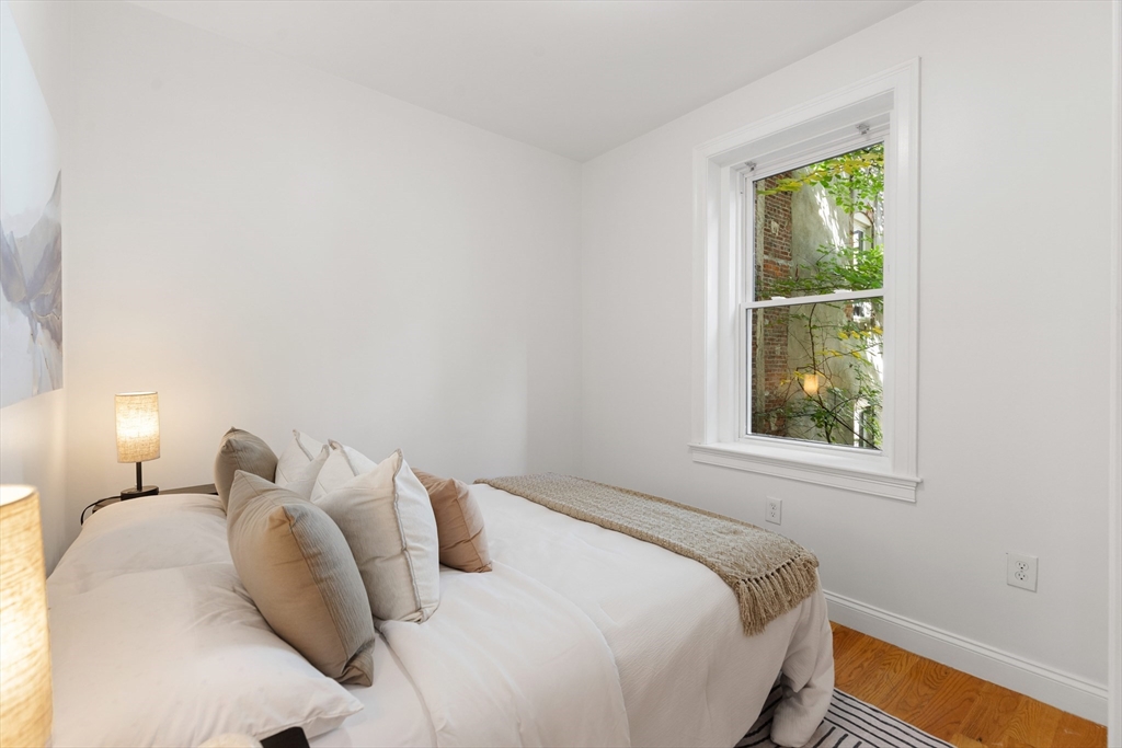 81 Prince Street, Unit 2 Boston, MA 02113 - Photo 15 of 22 a bedroom with a bed and a window
