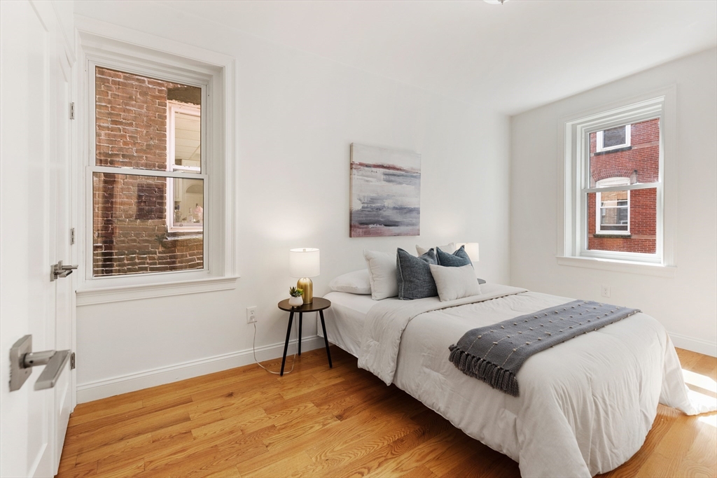 81 Prince Street, Unit 2 Boston, MA 02113 - Photo 16 of 22 a bedroom with bed and a window
