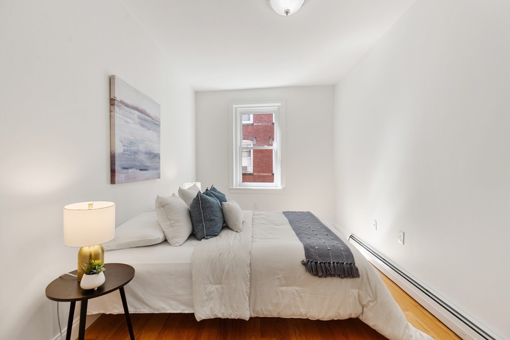 81 Prince Street, Unit 2 Boston, MA 02113 - Photo 17 of 22 a bedroom with a bed and window