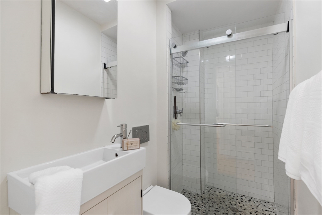 81 Prince Street, Unit 2 Boston, MA 02113 - Photo 21 of 22 a bathroom with a sink toilet and shower