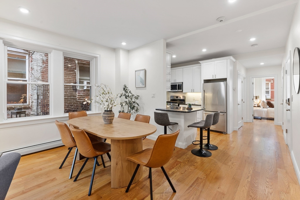 81 Prince Street, Unit 2 Boston, MA 02113 - Photo 3 of 22 a view of a dining room with furniture and wooden floor