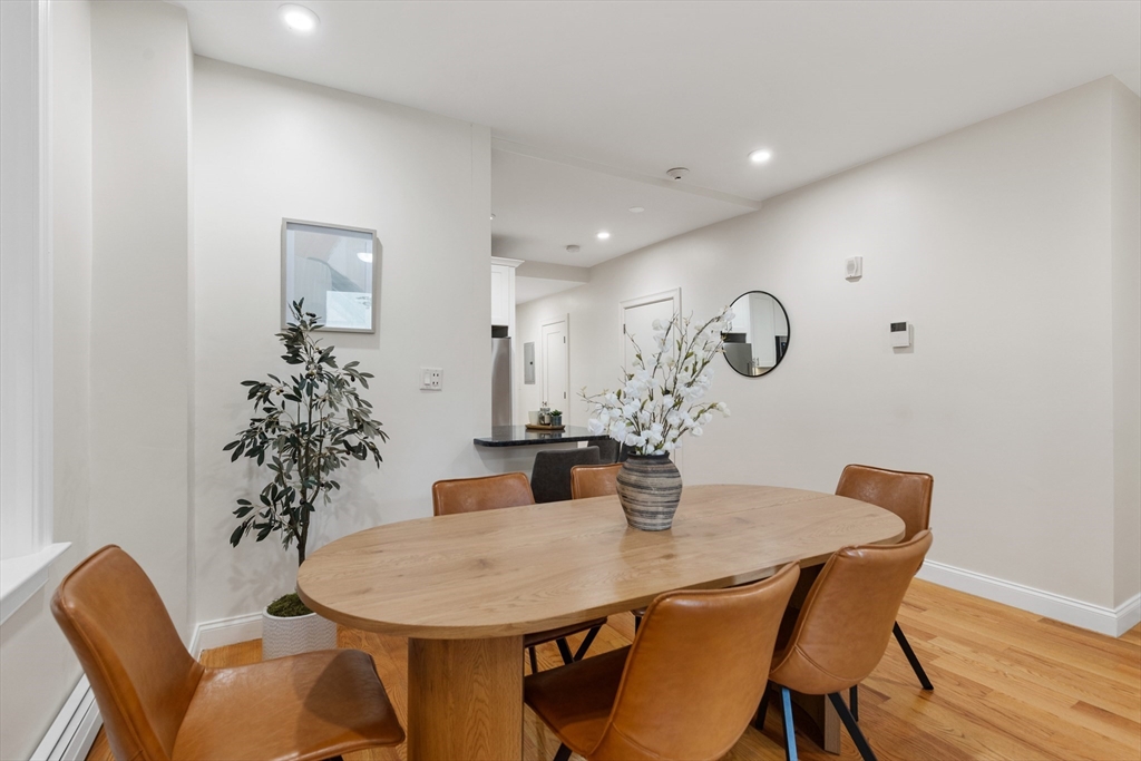 81 Prince Street, Unit 2 Boston, MA 02113 - Photo 4 of 22 a view of a dining room with furniture and wooden floor