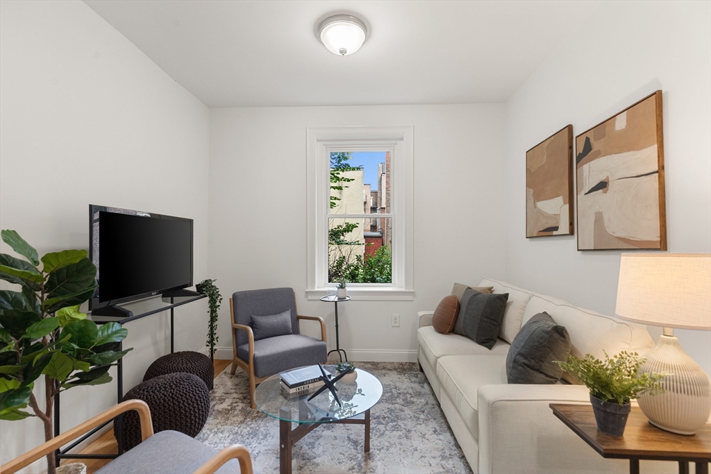 81 Prince Street, Unit 2 Boston, MA 02113 - Photo 5 of 22 a living room with furniture and a flat screen tv