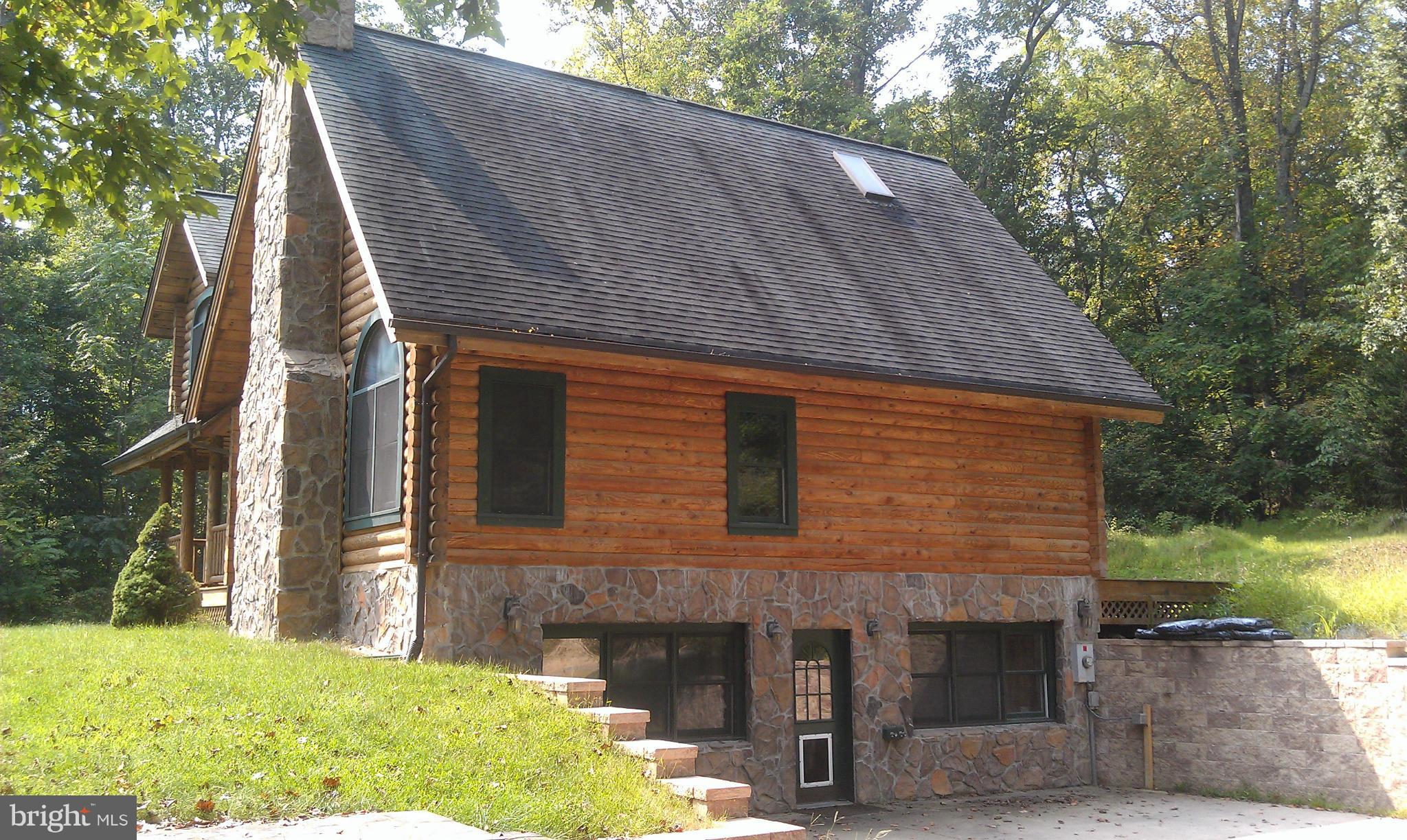 10471 Warland Road Marshall, VA 20115 - Photo 2 of 18 a front view of a house with a yard