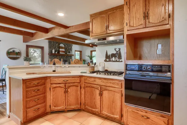 a kitchen with stainless steel appliances granite countertop a stove and a sink