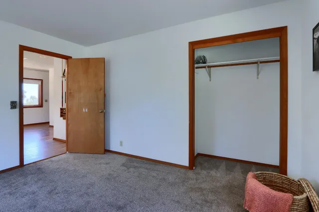 a bedroom with bed and window