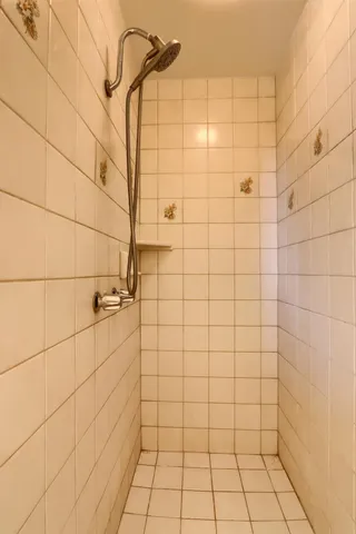 a utility room with stainless steel appliances granite countertop a sink stove and cabinets