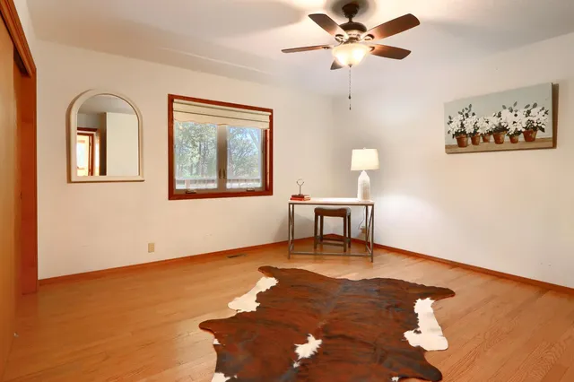 a view of front door with wooden floor