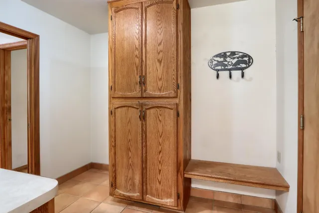 a view of dirt yard with a tree