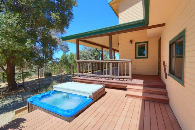 a front view of a house with a yard and a garage