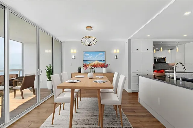 a large kitchen with granite countertop a sink and cabinets