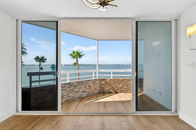 a bathroom with a granite countertop sink and a window