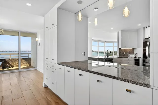 a spacious bedroom with a large bed and a couch