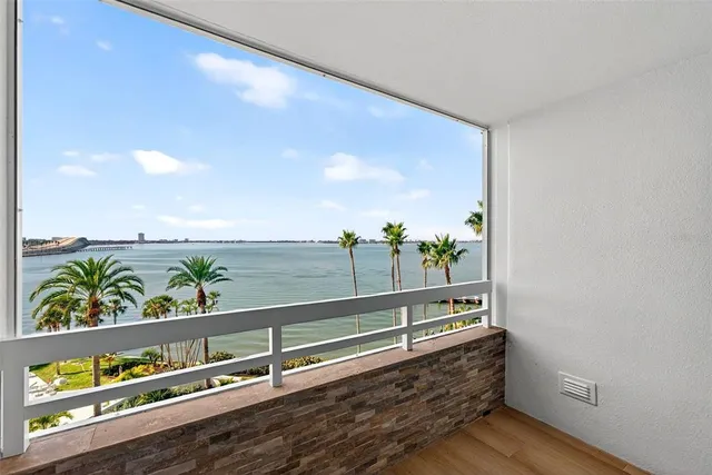 a terrace with outdoor seating and city view