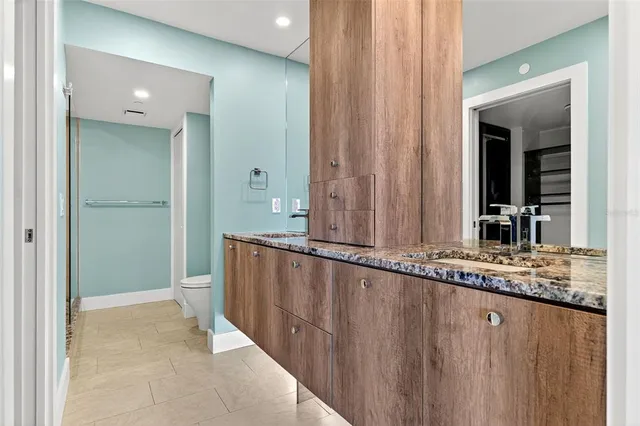 a view of a backyard with plants and a patio