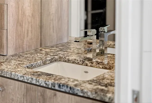 a view of multiple houses with palm trees