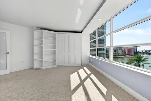 an aerial view of a city with ocean view